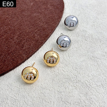 Monogram Orb Studs - E60