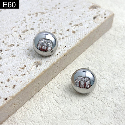 Monogram Orb Studs - E60